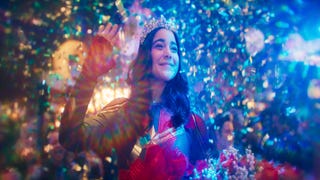 Ms. Marvel still Iman Vellani as Kamala Khan wearing a Tiara and waving whilst surrounded by confetti