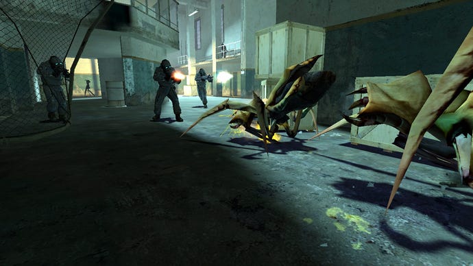 Antlions, large insectoid spidery things, in a firefight with Combine soldiers in Half-Life