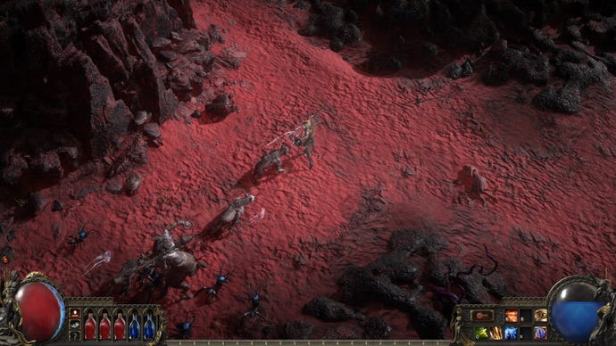 A red sandy area in Path of Exile 2 surrounded by rocks