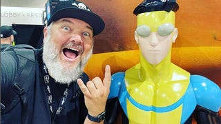Shawn Kirkham and an Invincible statue at Comic-Con International: San Diego 2022