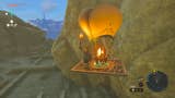Link using a hot air balloon to explore a canyon containing the Forgotten Temple in The Legend of Zelda: Tears of the Kingdom.