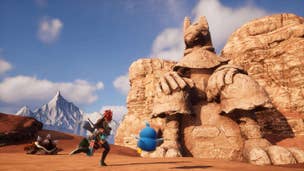 The player and two Pals approach a statue of Anubis in Palworld