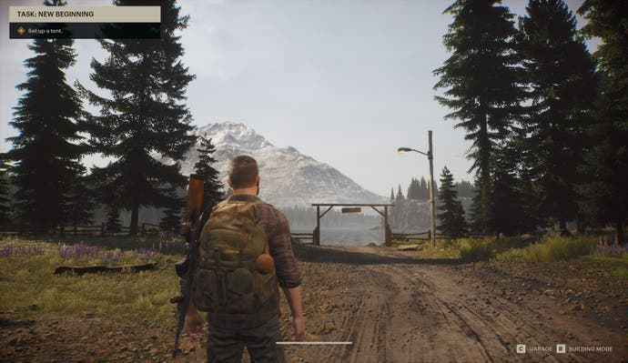 The Day Before player character looks out over North American mountainous region