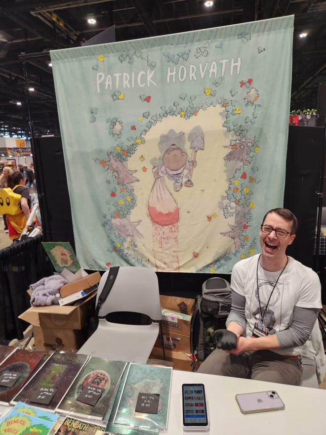 Photograph of Patrick Horvath at his booth at C2E2