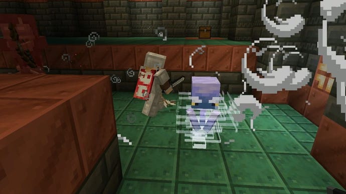 A player fighting the new Breeze enemy in Minecraft update 1.21, surrounded by whirling puffs of air.