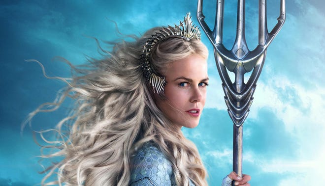 Cropped image of Nicole Kidman wearing a white wig and holding a trident