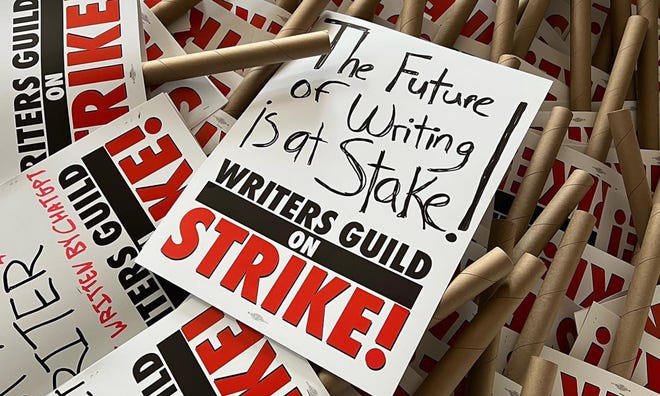 Photograph of signs reading The Future of Writing is at Stake!