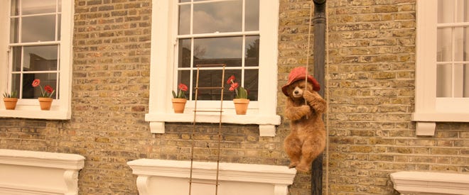Movie still from Paddington 2 featuring Paddington Bear