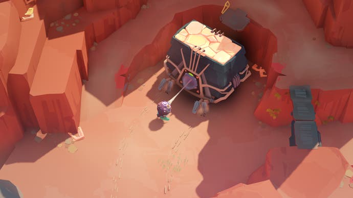 El personaje del jugador tira de una enorme criatura insecto de piedra para colocarla en su posición en Cocoon de Geometric Interactive.
