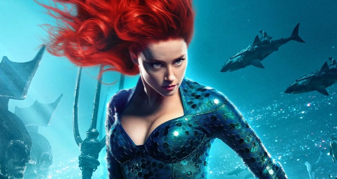Cropped image of Amber Heard in costume under water