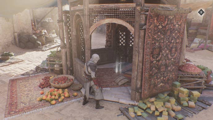Basim looks inside a small gazebo with a treasure inside of it in Assassin's Creed Mirage