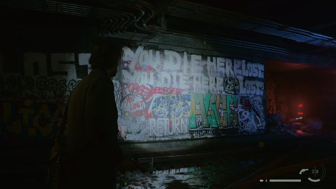 Alan Wakes look at a wall filled with graffiti in Alan Wake 2