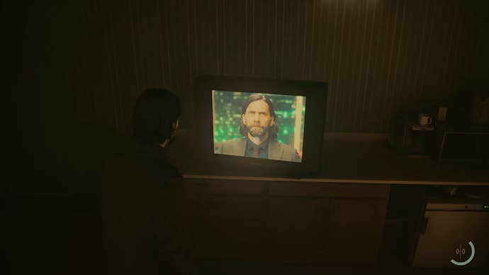 Screenshot from Alan Wake 2 showing in-game Alan watching live-action Alan on the TV