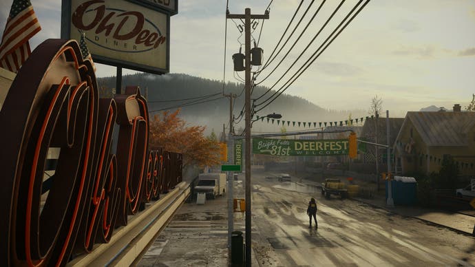 Alan Wake 2 screenshot showing a rusted out American town with Oh Deer sign.