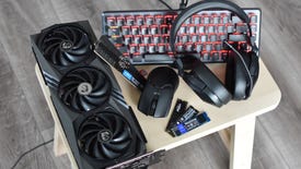 Various PC components and peripherals on a small table.