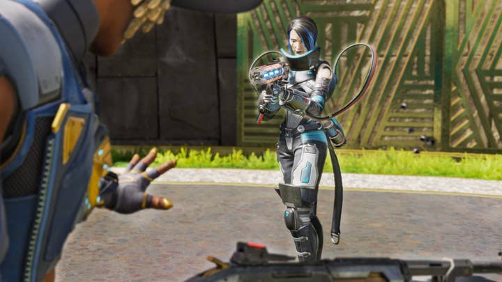 Catalyst from Apex Legends approaches another character with her gun drawn