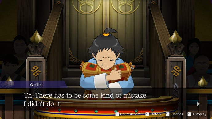 A young boy clutches a pillow on the witness stand in the Apollo Justice: Ace Attorney Trilogy