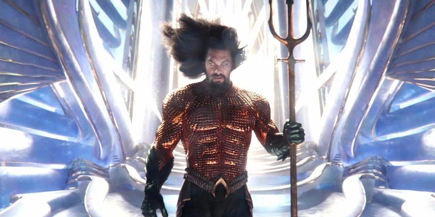 Aquaman in front of a bright throne