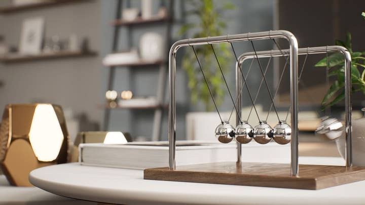 Unreal Engine 5 environment of a clean office with a Newtonian physics toy on a desk