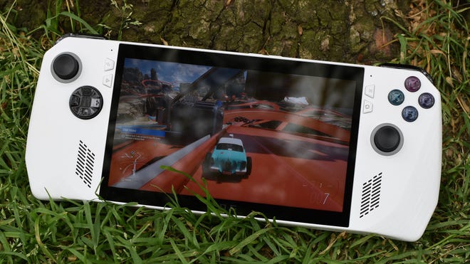 An Asus ROG Ally propped up against a tree as it runs Forza Horizon 5.