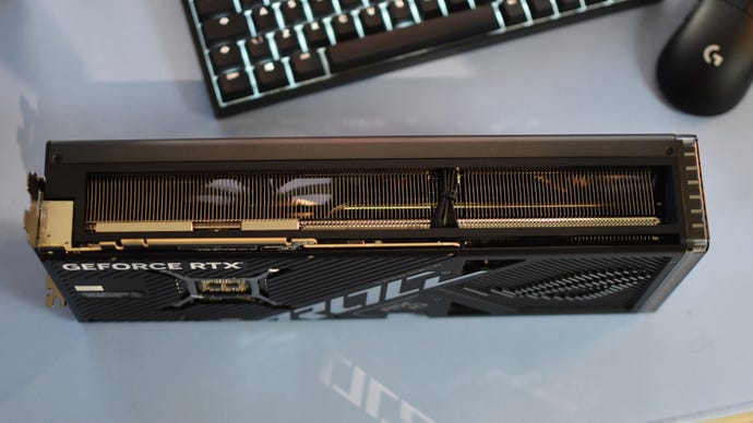 A Asus ROG Strix GeForce RTX 4080 Super Gaming OC Edition graphics card on its side.
