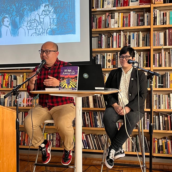 Photograph Thien Pham interviews Ayuyang during a book release event hosted at Pegasus Books in Berkeley, CA, for The Man and the McIntosh Suit. Photo by May Ung.
