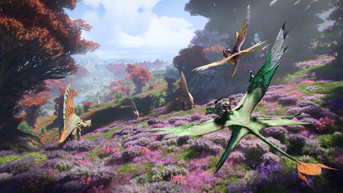 Two Na'vi characters flying on large lizard birds through the world of Pandora, which is lush and green with purple and red foliage, and dinosaur-like creatures ambling around.