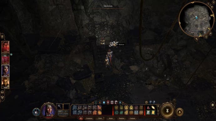 Cursor highlighting a skeleton next to a cave-in in a dark room.