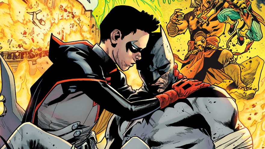 Damian cradles Batman
