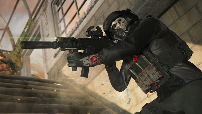 a soldier with a skull mask dressed in black at the bottom of stairs outside, wearing a semtex vest and holding a battle rifle up that has a green laser optic