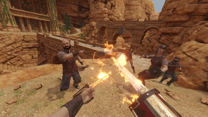 Duelling a group of enemies in a rocky desert ruin, wielding katanas which are on fire, in the VR game Blade And Sorcery