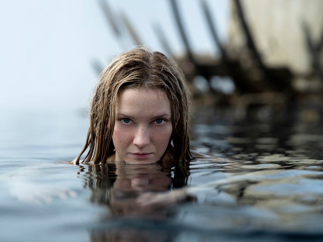 Image of a woman looking out of water