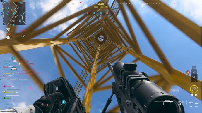Call of Duty Modern Warfare 3 screenshot of the player scending a cord up to the top of a yellow crane for sniping in multiplayer
