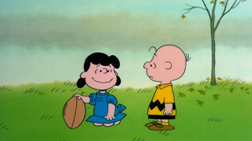 Lucy and Charlie Brown with a Football in A Charlie Brown Thanksgiving