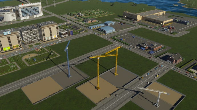 A series of cranes begin construction work in Cities Skylines 2.