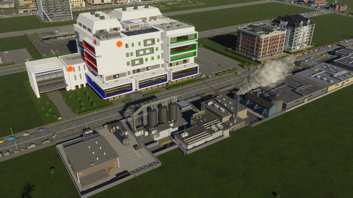 A hospital, questionably built opposite an industrial building, in Cities Skylines 2.