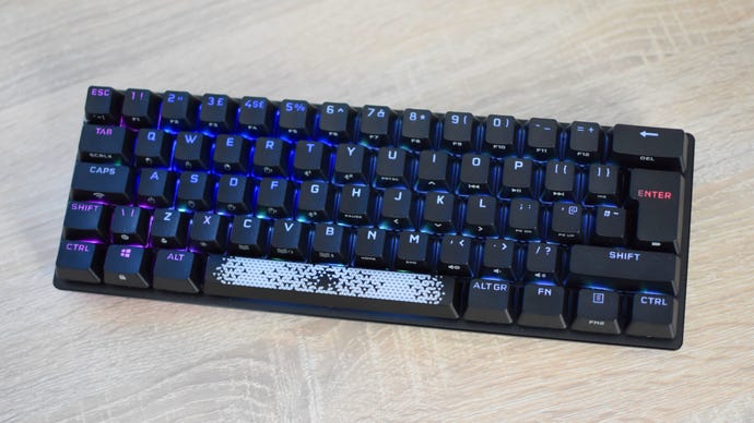 The Corsair K70 Pro Mini Wireless gaming keyboard on a desk.
