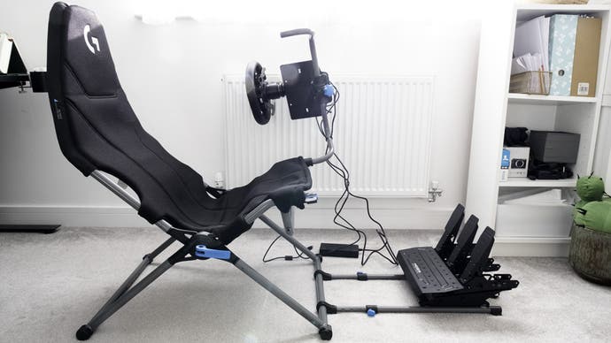 moza r5 bundle mounted on a playseat challenge x logitech g edition folding racing cockpit, rotated to allow easier entry
