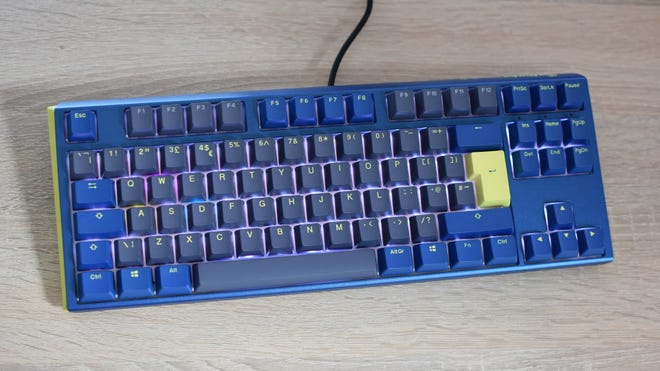 The Ducky One 3 TKL keyboard, in its Daybreak colour scheme, on a desk.