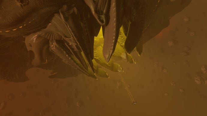 A tiny ship flies into the mouth of a Thargoid Titan in Elite Dangerous