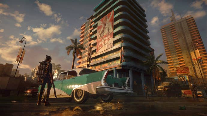 دنی روژاس با یک ماشین و ساختمان در Far Cry 6 روبرو است