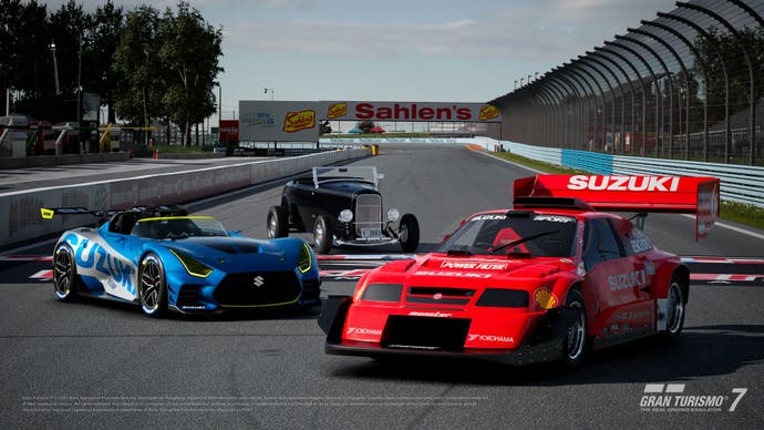 Three cars - a Suzuki GT Vision, a 1932 Ford Roadster and the iconic  V6 Escudo Pikes Peak Special - sit on the back straight of Watkins Glen International.