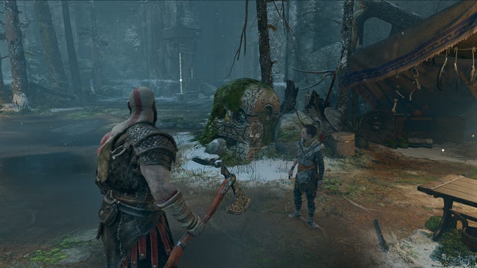Kratos stands in front of a skull-shaped stone in God of War. Shows DLSS upscaling to 1440p.