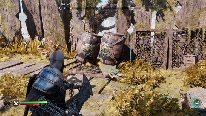 Two barrels blocking the path to the second unlit brazier in God of War Ragnarok