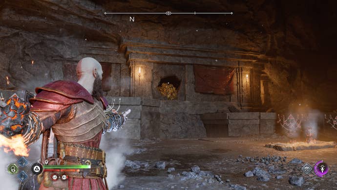 Kratos throwing a firebomb to light a Nornir brazier in the Raider Hideout in God of War Ragnarok
