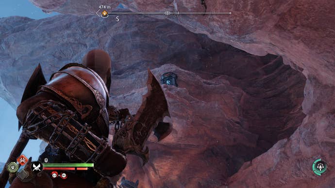 Kratos looking up at a brazier in God of War Ragnarok