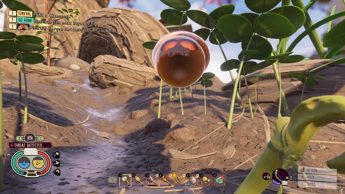 Grounded player staring at the orange blob with beaming red eyes that represents a spider in arachnophobia mode.