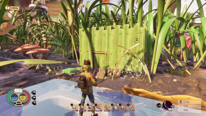 Grounded screenshot showing a player looking over a small two-story base, which is constructed from grass walls and some stone stairs. There is a web outside holding a drop of water.