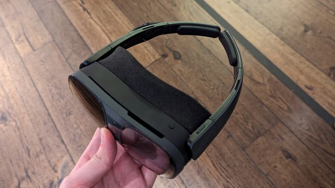 The Vive XR Elite headset with its battery pack removed and replaced by temple tips, making it ready for mobile use.