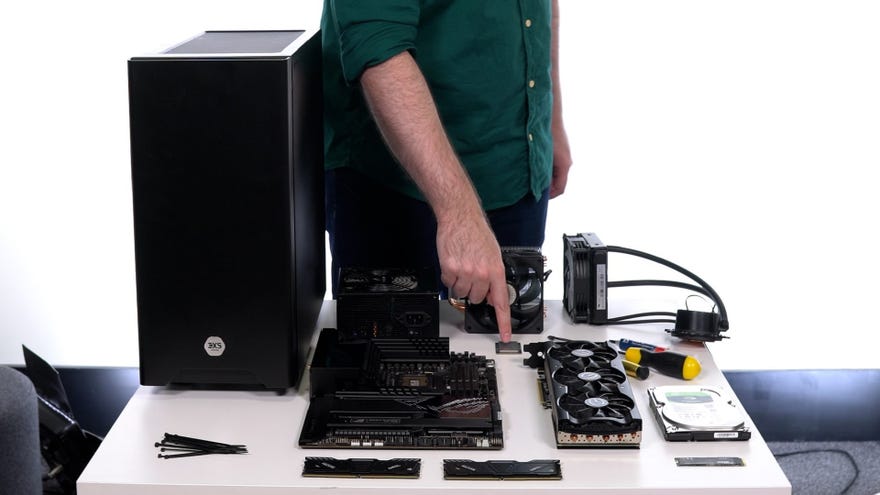 All the components one would need to build a gaming PC from scratch, laid out on a table.